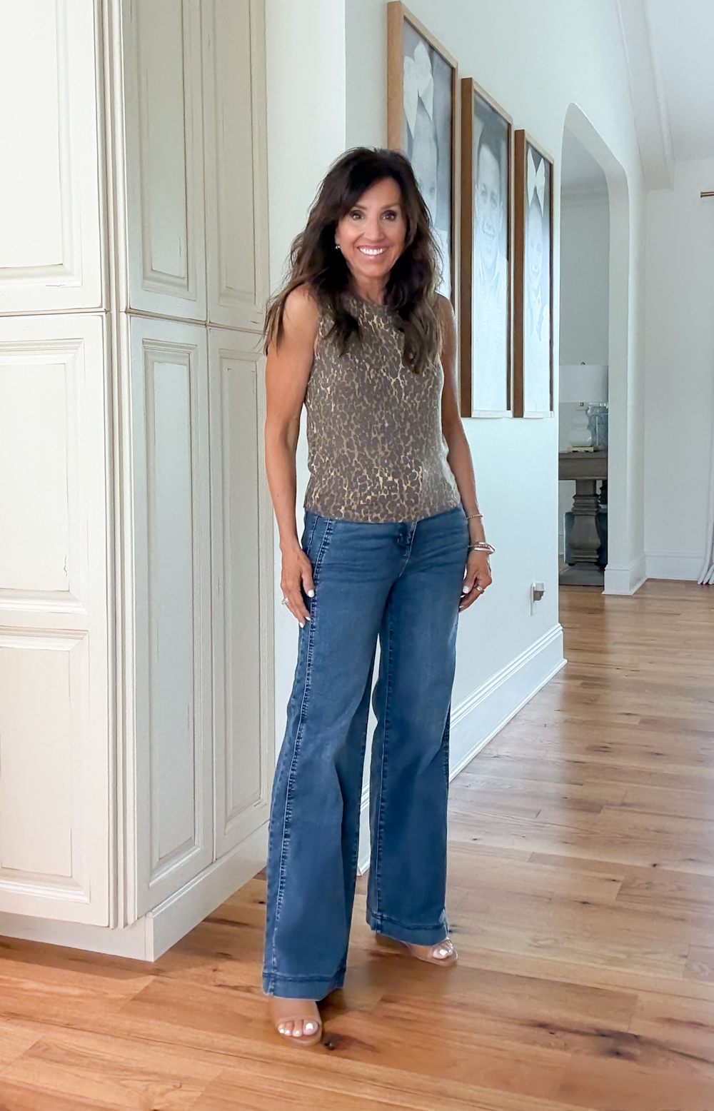 WOMAN STYLING A LEOPARD TANK TOP FROM NORDSTROM