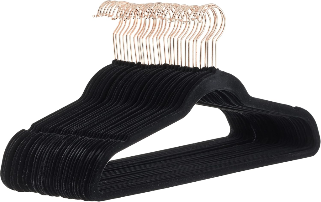 Set of slim black velvet non-slip hangers stacked together
