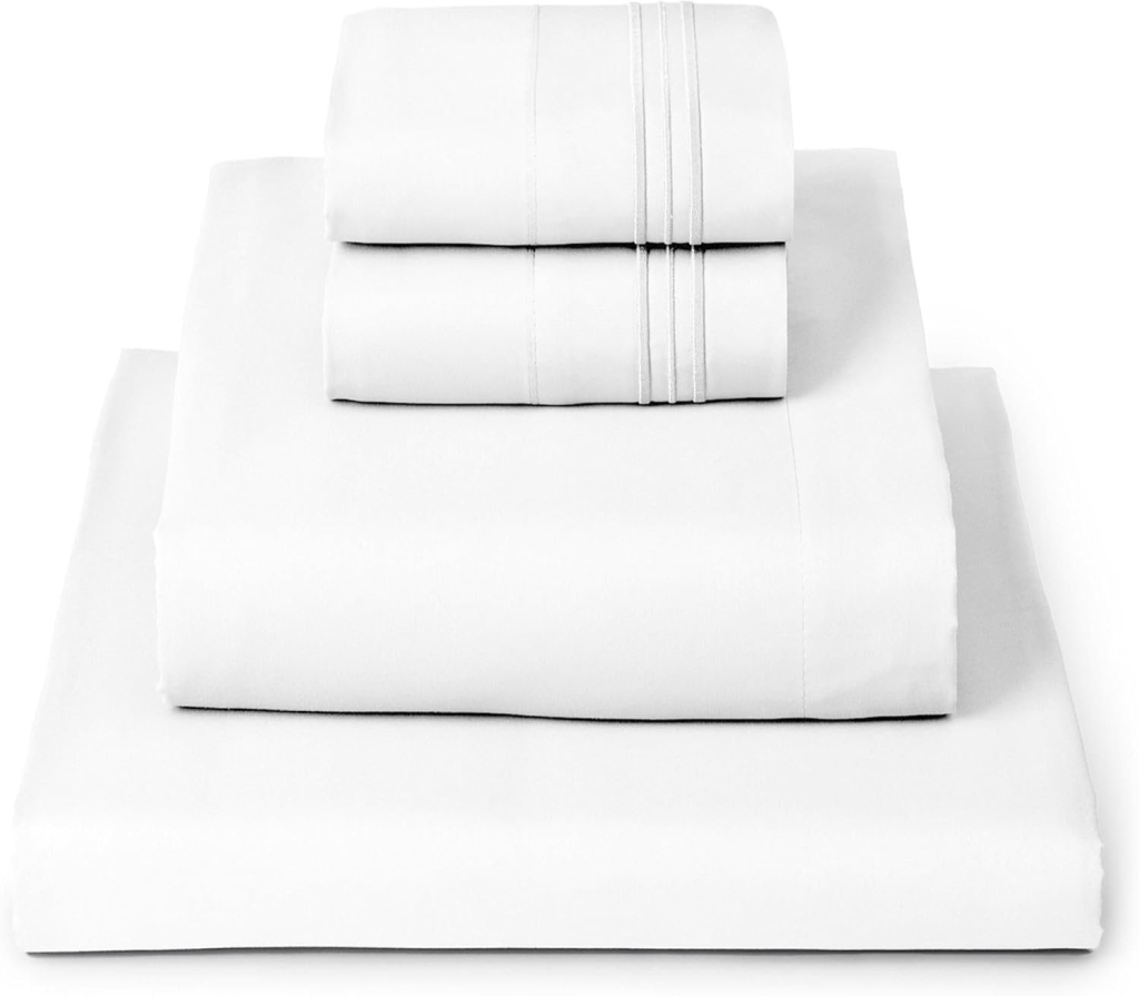 Stack of Mellanni white bed sheets folded on a bed, Amazon best seller in sheets.