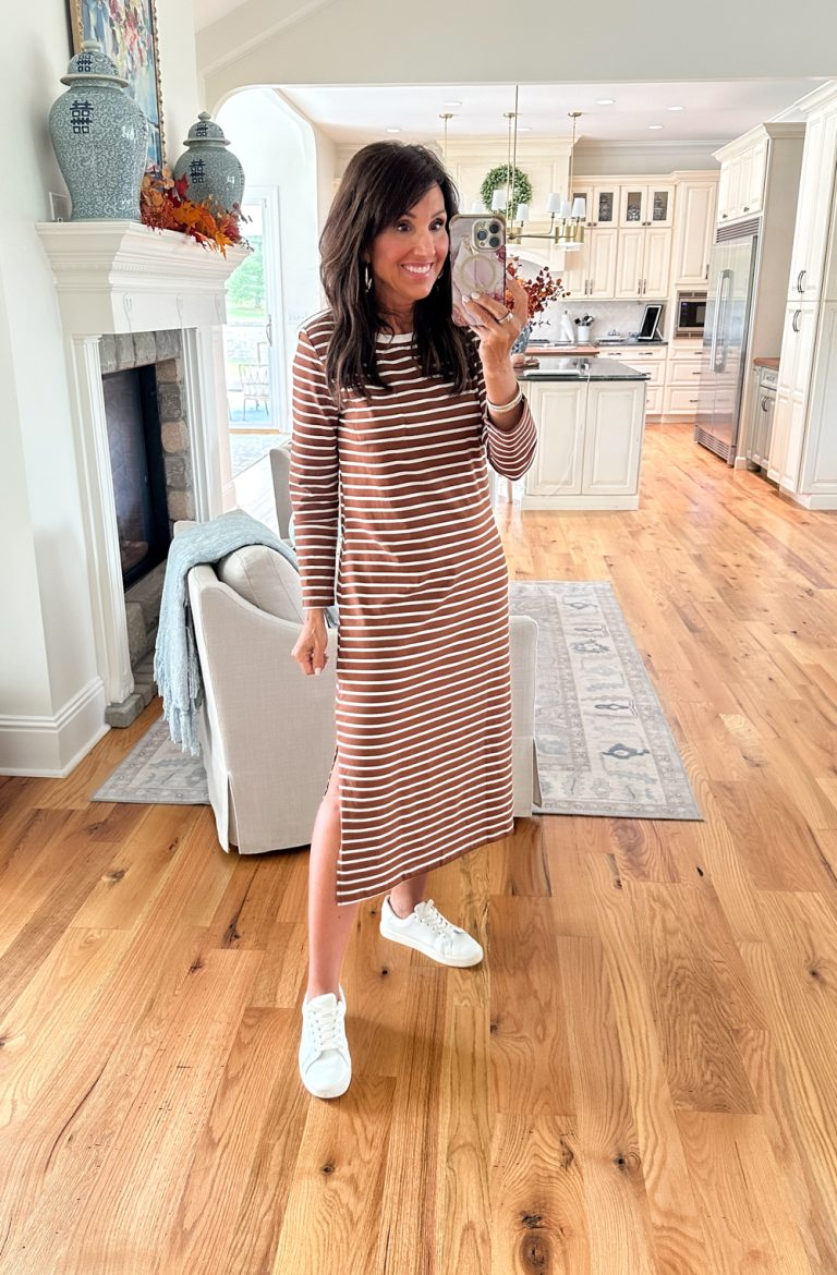 A blogger wearing a brown and white striped dress with white sneakers