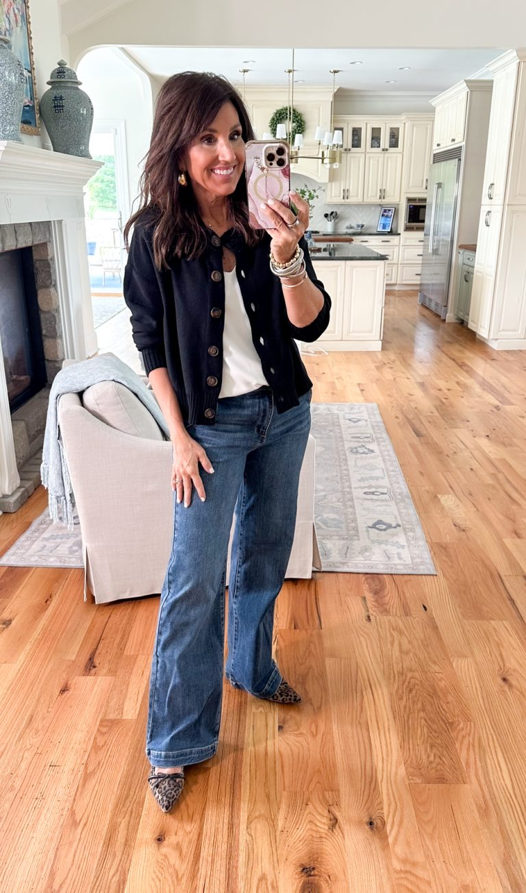 Cyndi wearing a black button-front cardigan over a white tee with wide-leg jeans and leopard flats, an easy Amazon fall outfit idea.