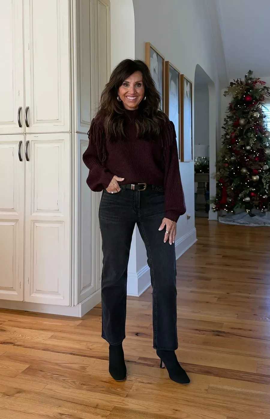 CYNDI WEARING A SWEATER JEANS AND BOOTS FOR THANKSGIVING 2025