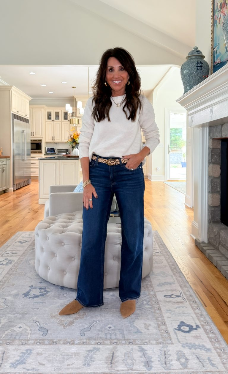 Cyndi Spivey wearing a sweater with boots and jeans from one of her top read posts.