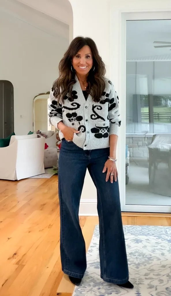 Cyndi Spivey wearing a patterned cardigan over a simple top with jeans, styled for a cozy everyday outfit.