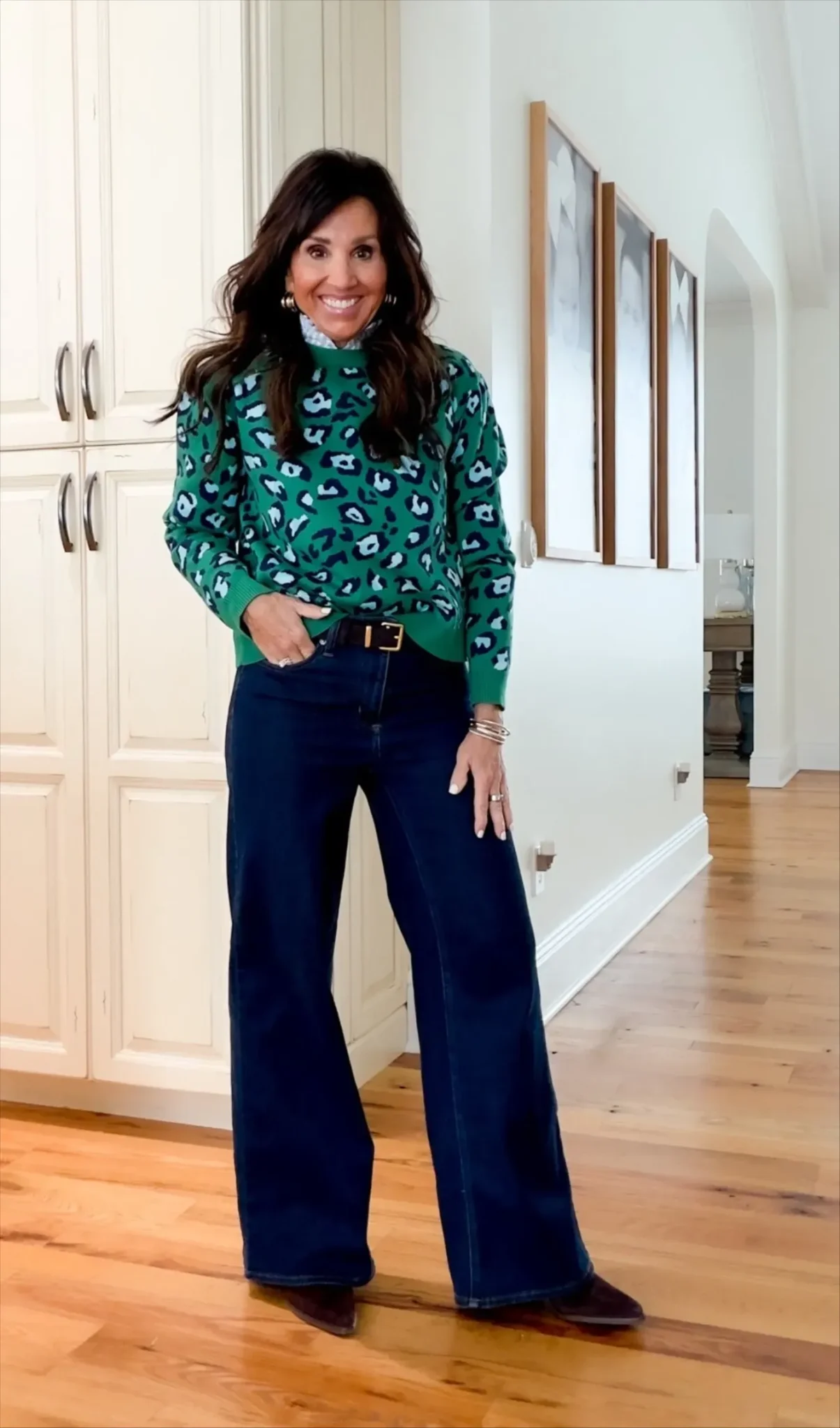 Cyndi wearing a green and blue sweater