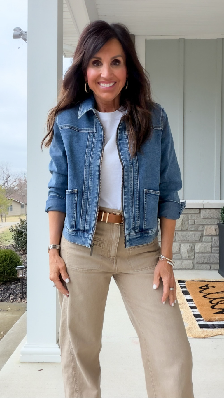 Cyndi wearing a trendy denim jacket with a white tee.