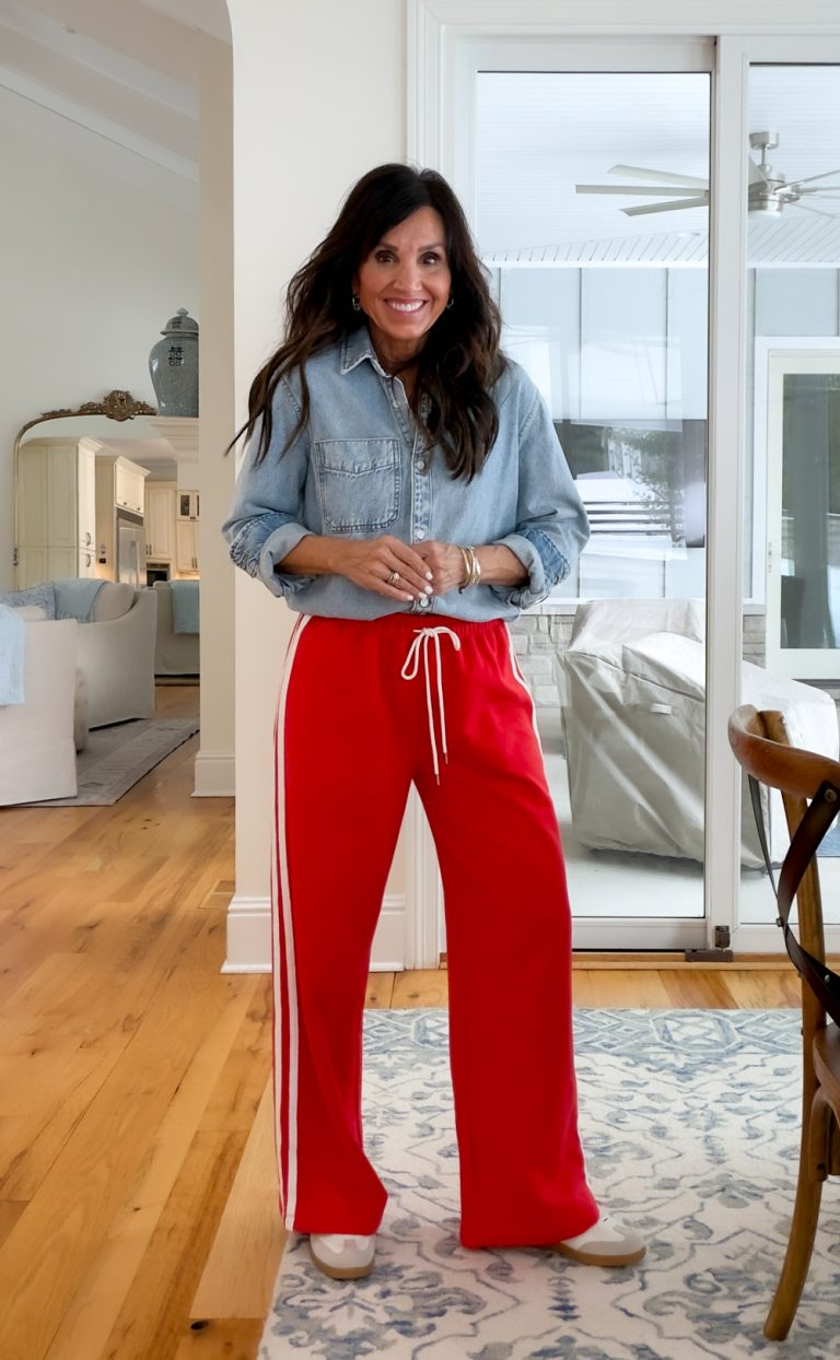 Cyndi Spivey wearing track pants with denim shirt. 