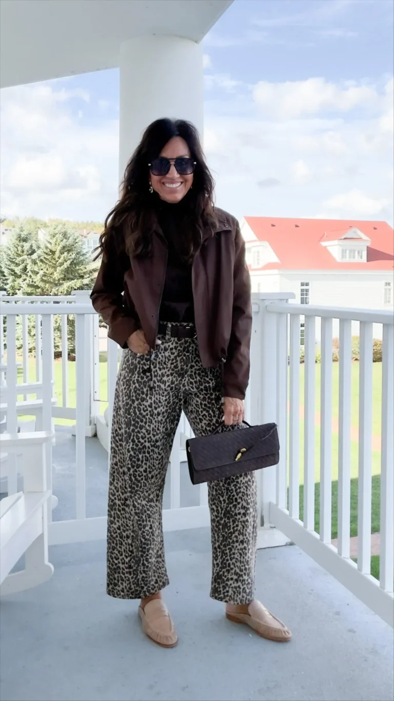 Cyndi Spivey wearing a fall outfit with leopard pants and mules.